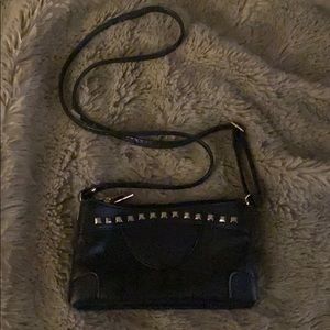 Faux leather studded cross body purse.